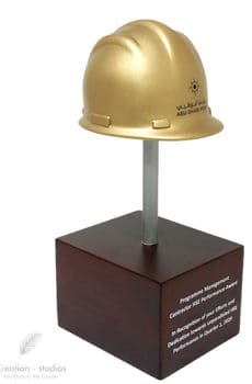 3d print golden helmet award on wooden base