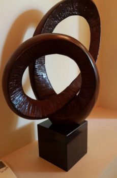 Circle twisted maroon abstract art pieces in UAE