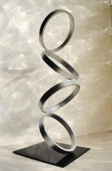 Silver Abstract metal art in form of rings