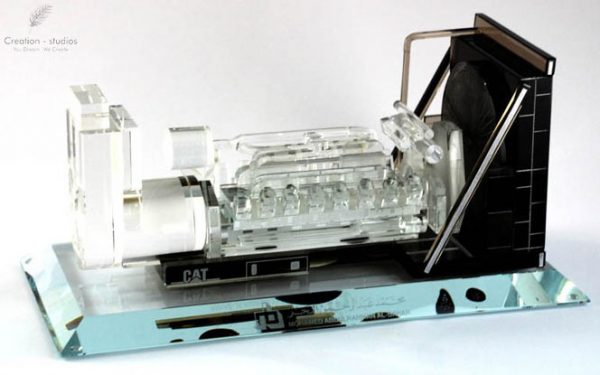 Engine scale model in crystal with branding.
