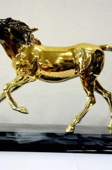 Arabic gold plated horse sculpture with crystal base