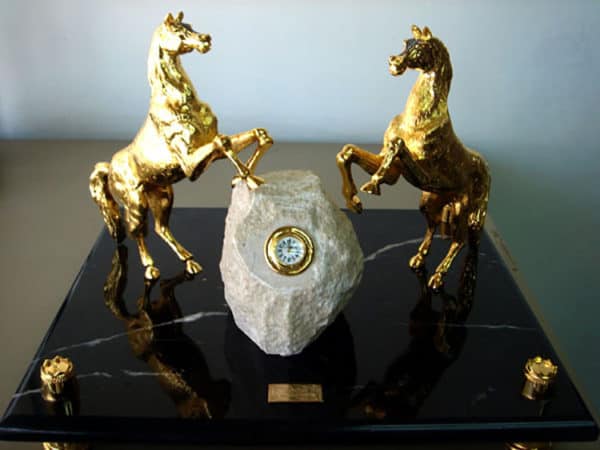 Gold plated horse sculptures with clock made in Dubai
