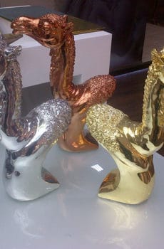 Gold, bronze and silver platted camel head sculptures