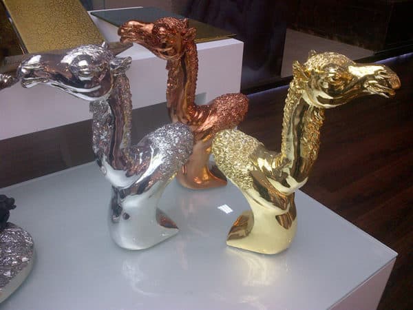 Gold, bronze and silver platted camel head sculptures