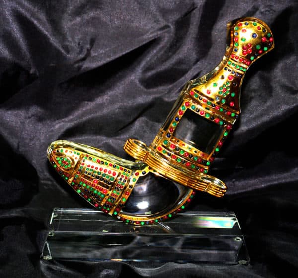 Gold platted khaner souvenir on crystal base