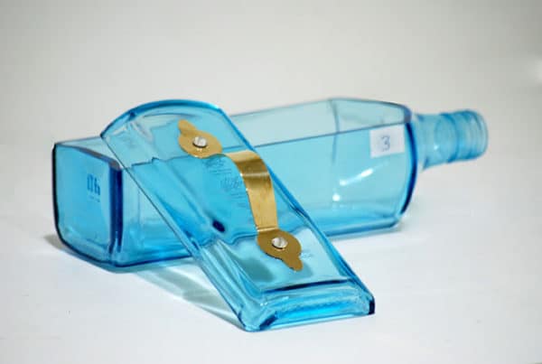 Sustainability gift idea from glass bottle with metal handle