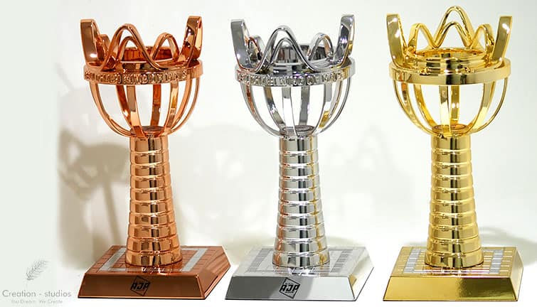 3d printed football trophies in gold , silver, bronze.